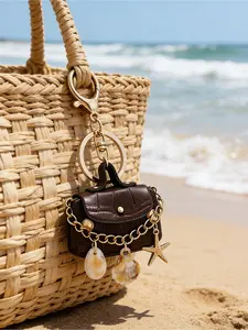 Fashionable mini bag pendant, Bohemian style beach mini bag keychain, brown textured leather keychain with shell and starfish charms, gold-tone lobster clasp keychain suitable for women