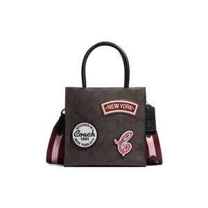 Coach Cally 17 Mini Handbag, Crossbody and Shoulder Bag for Women, Classic Logo-Embossed and Ski-Pattern Patch Decor, Coated Canvas and Leather, Dark Brown