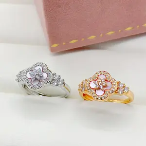 Cherry blossom pink four-leaf clover copper ring with zircon inlay, niche elegant rose gold ring, light luxury high-end trendy jewelry, new model