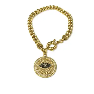 Ilseras con un dije de ojo en oro laminado size 7