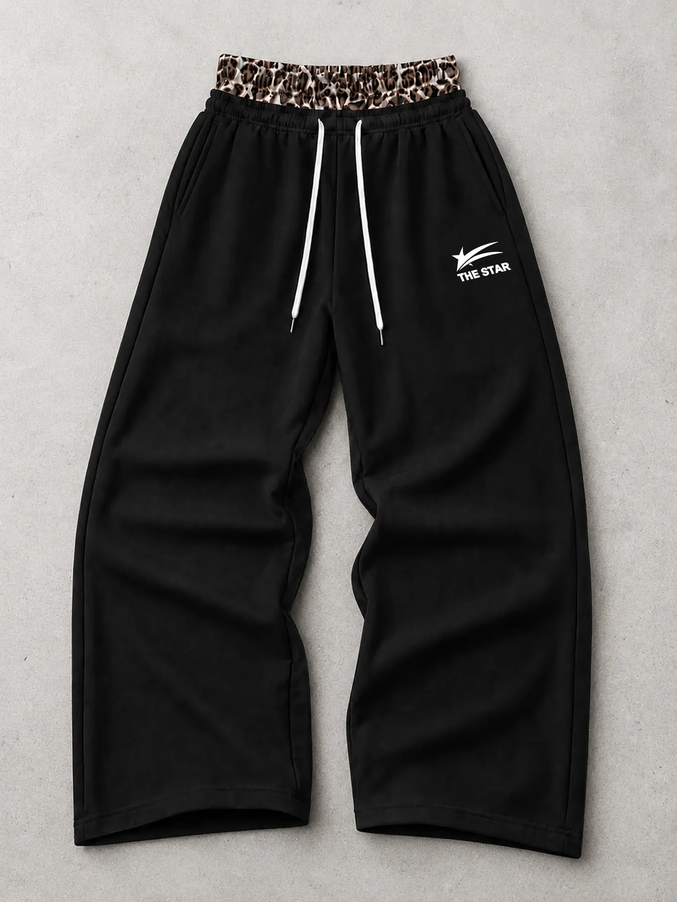 Men’s loose street-style joggers with dual waistband and leopard-print waist design; jogger alternative.