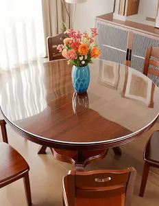 Round solid wood dining table with transparent soft glass table mat