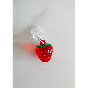 strawberry charge port charm