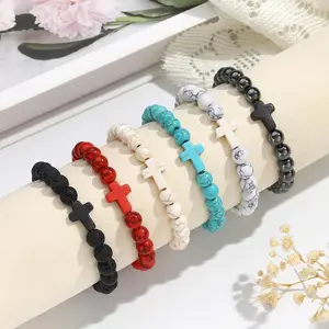 Unisex elastic cross bracelet made from volcanic turquoise black gallstones — a great gift for couples