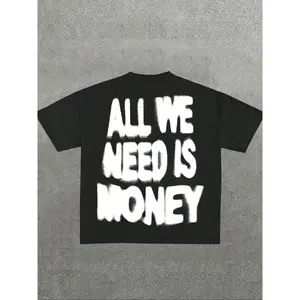All We Need Is Money Graffiti Graphic T-Shirt. Black oversized short streetwear tee with bold spray paint print. High street hip hop aesthetic, trendy fashion, TikTok viral essential for gym & casual wear.