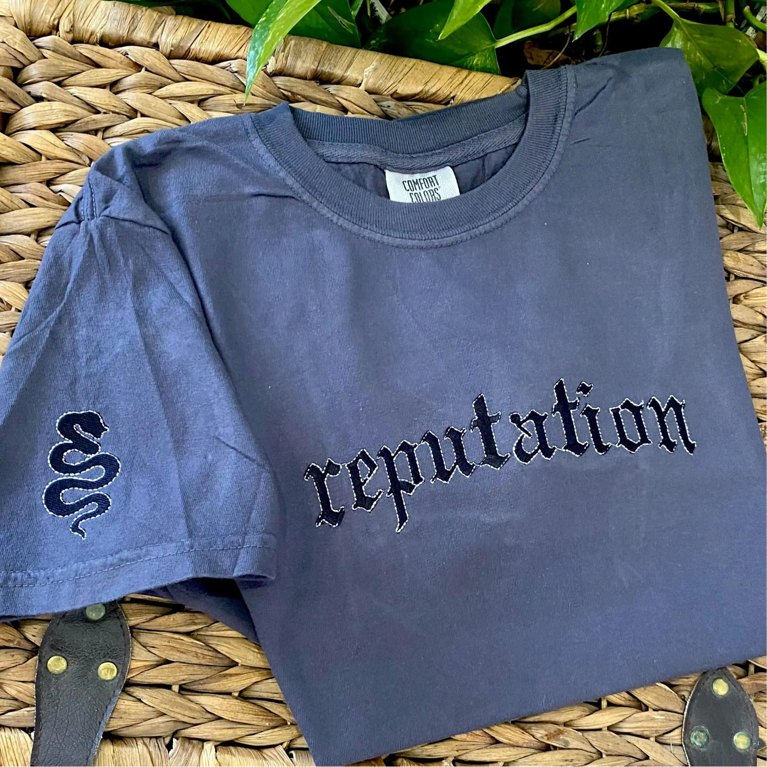Embroidered Reputation tee shirt on charcoal grey with sleeve embroidery