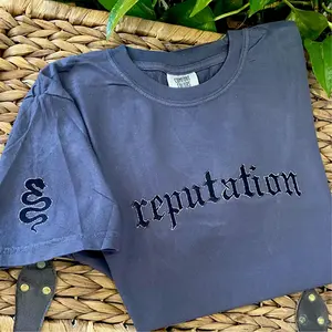 Embroidered Reputation tee shirt on charcoal grey with sleeve embroidery