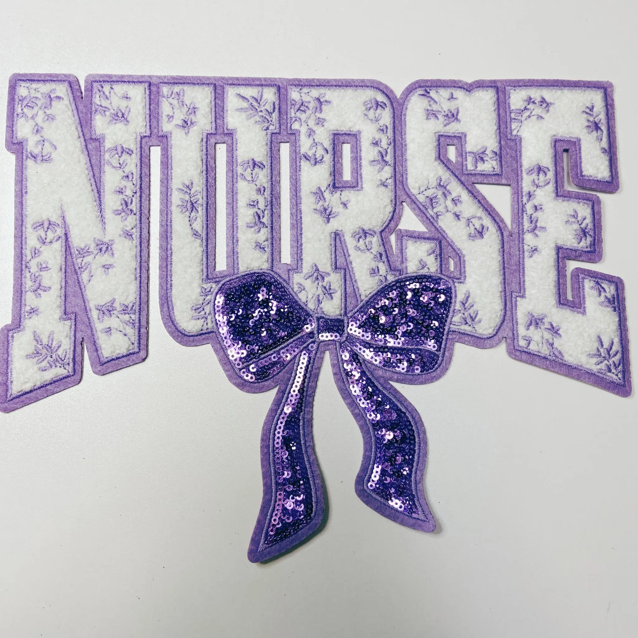 11" Nurse with sequin bow and embroidered Floral Purple - Sequin & Chenille Patch