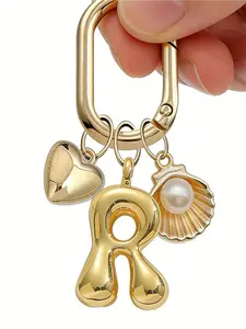 Gold Bubble Letter A-Z Keychain, Cute Initial Pendant With Heart Shape And Ocean Pearl Shell, Shiny Metal Letter Keychain, Personalized Bag Charm, Handbag Backpack Wallet Hanging Decor, Car Key Chain. Suitable For Daily Use, Travel, School, Shopping
