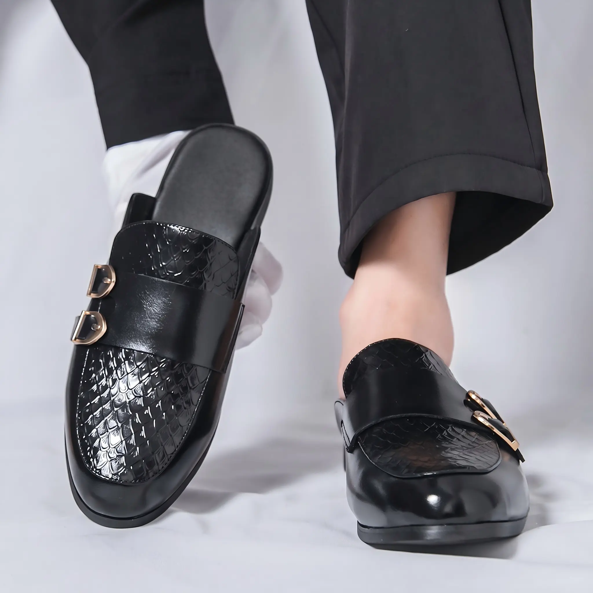 Men’s black snakeskin leather driving loafers with gold buckle accents — a luxurious slip-on for vacations and evening dinners