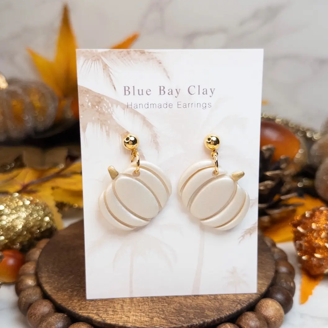 Blue Bay Clay Handmade White Shimmer Pumpkin Dangle Earrings Handcrafted Clay Fall Jewelry for Autumn Enthusiasts Hypoallergenic Nickel-Free Comfortable Safe Wear