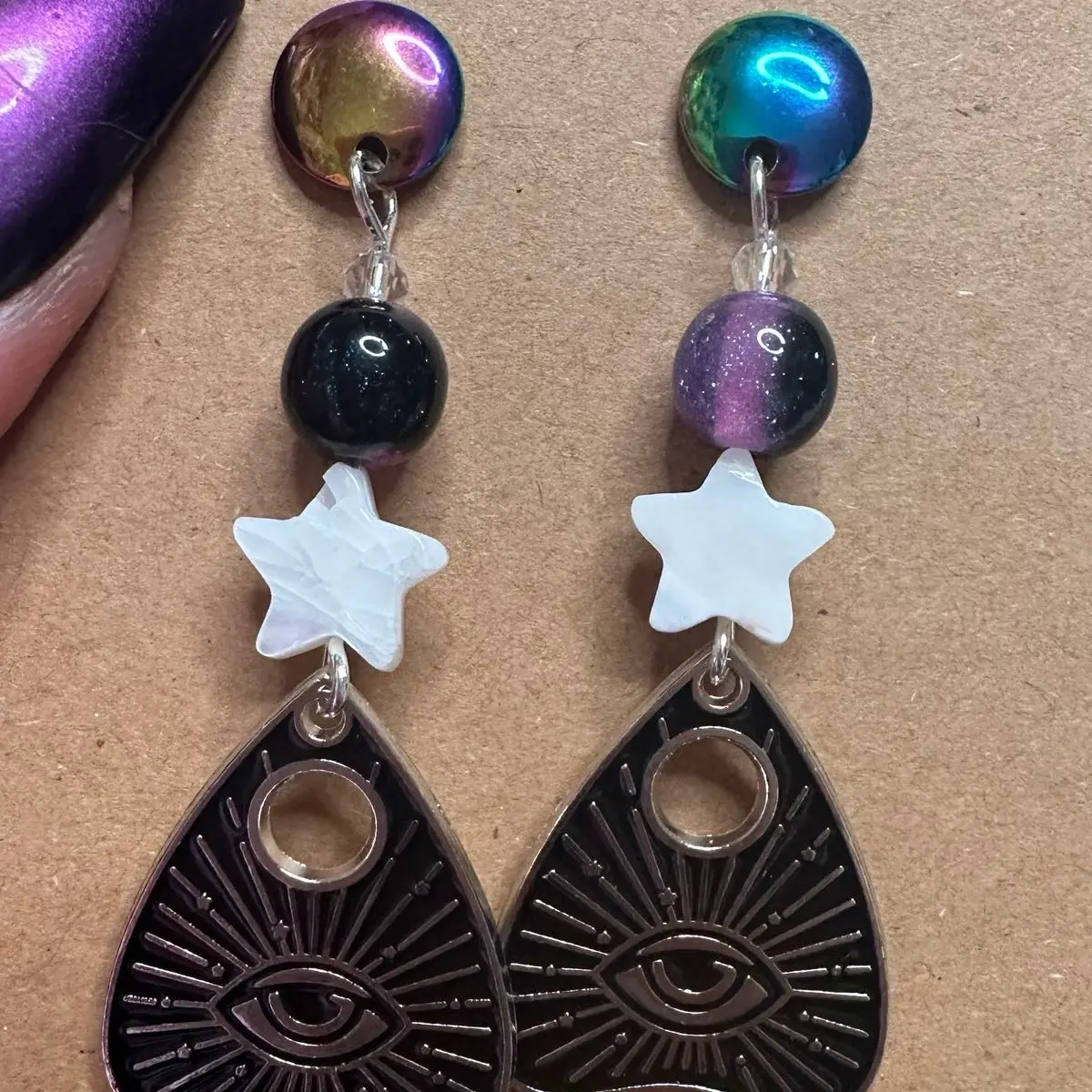 Ouija Evil Eye Shell Star sparkly purpke rainbow dangling earrings