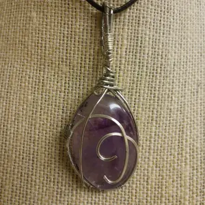 Translucent Amethyst Oval Cabachon in Silver - Genuine Gemstones, I do show my hands in photos, it allows an accurate perception of size as measurements can be a bit deceiving. This is a beauty see video for a better look.