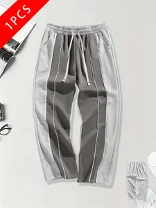 Men’s knit casual pants, loose straight cut, color-block design, exposed seam detail, spring/autumn style