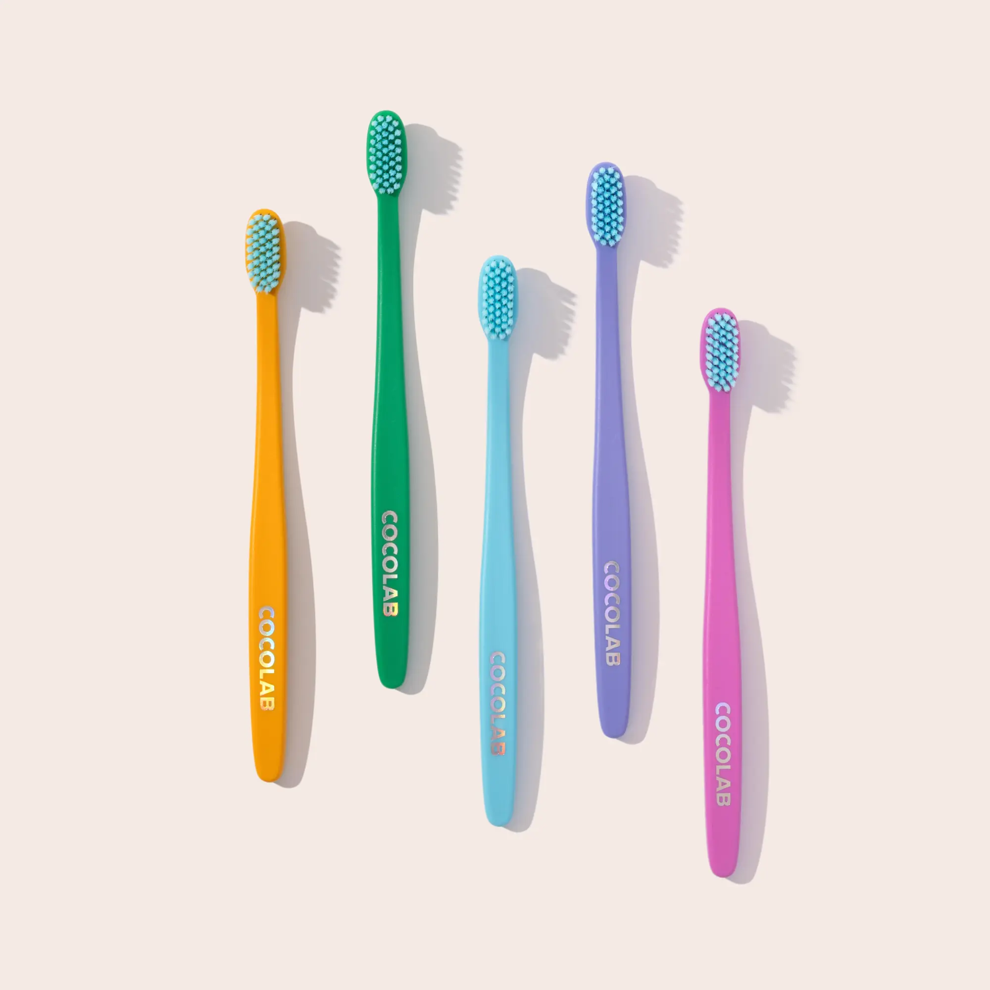 COCOLAB 5 Pack of Cocobrush Toothbrushes - Pool Blue, Bright Jade, Golden Poppy, Lilac Cloud, Cherry Blossom — 16x More Effective – Dentist-Designed Oral Care for a Cleaner, Brighter Smile