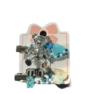 Ocean Riches Hair Clip Set with Teddy Bear and Surfboard Design Featuring Blue and White Beads