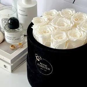9 Ivory Roses - Black Round Velvet Box