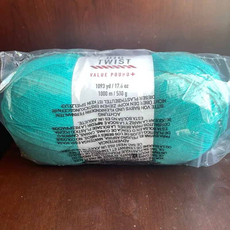 1 Roll of Big Twist yarn 1093 yd/ 17.6 oz  1000 m/ 500g  100% Acrylic  Color- Magenta, yellow and Teal
