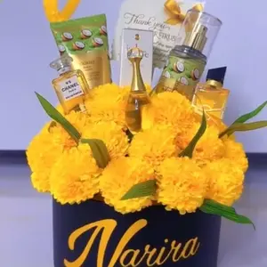 Narira Gift Flowers with Yellow Blossoms and Assorted Products in a Decorative Box