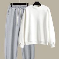 Grey pants and white sweater