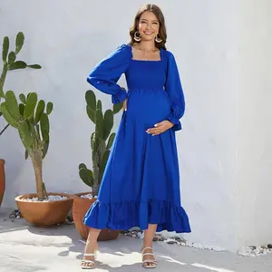 Casual maternity dress with a ruffled hem, square neckline, elastic waistband, and a large, flowing skirt