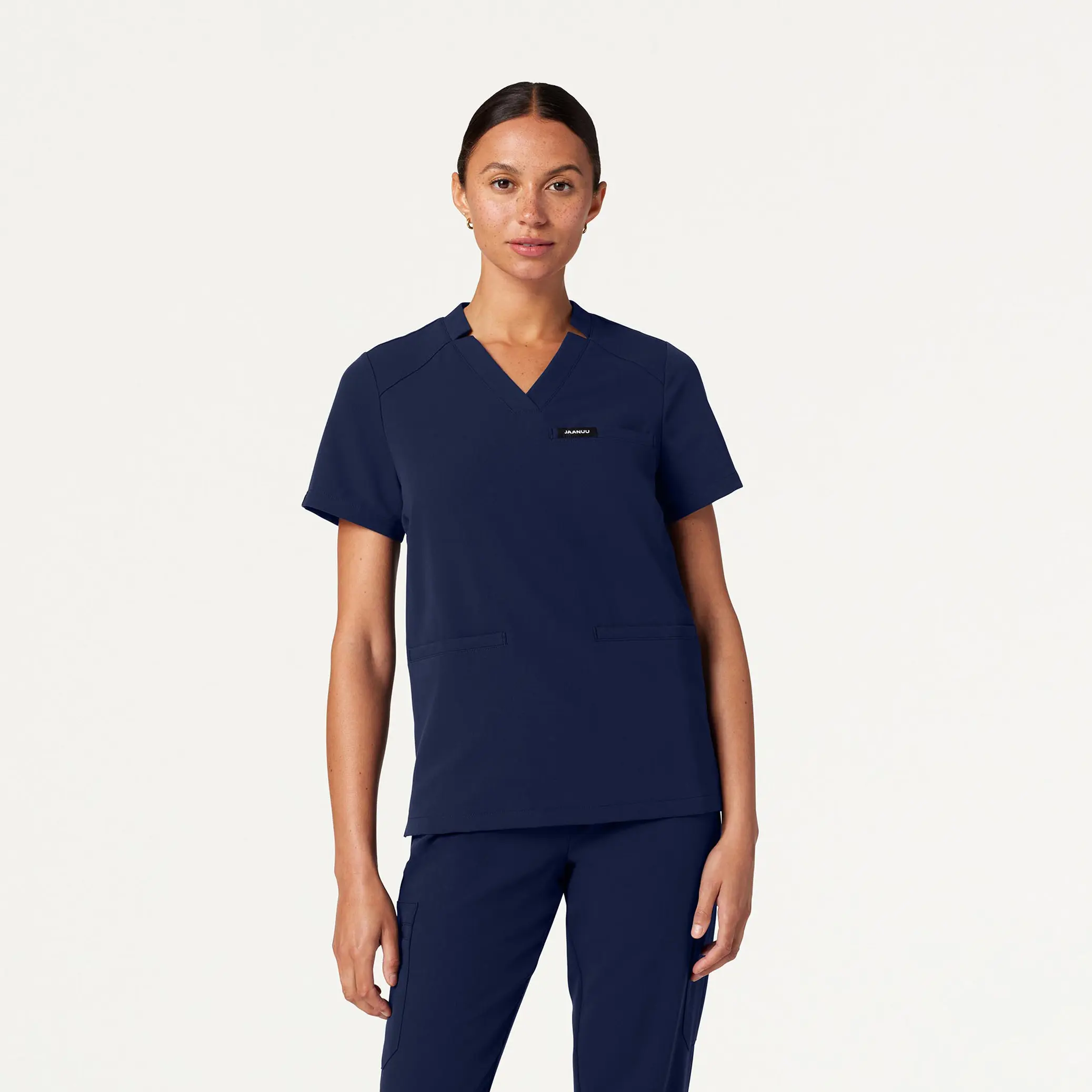 JAANUU Helia Women's Notched V-Neck Scrub Top - 4-Way Stretch Polyester-Rayon Woven Fabric, Classic Fit, Wrinkle Resistant, Antimicrobial Workwear with 3 Functional Welt Pockets, Side Vents