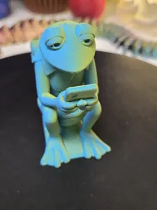 3d printed frog on a toilet