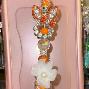 Cute Orange Bunny Fancy Pen with Sparkling Butterfly Beads and White Flower Charm for Stylish Writing