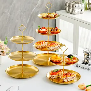 A gold stainless steel 3-layer cupcake rack, stainless steel cup display tower, cake rack, dessert tray, cake, fruit and candy display rack, desktop decoration for Christmas, wedding, birthday, baby shower, tea party plates
