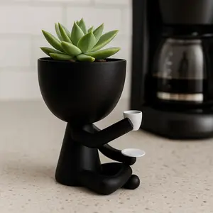 Planters for succulents with a design of people drinking coffee