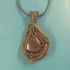 Handmade Wire Wrapped Silver Sheen obsidian Pendant with Intricate Copper Wire Design and Unique Teardrop Shape