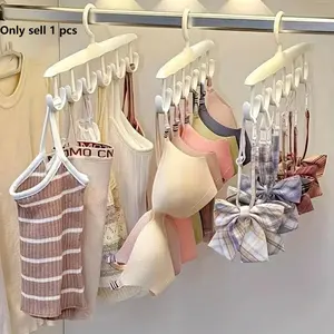 Multifunctional rotating clothes hanger, Rotatable clothes hanger, 12-hook design can store small items such as underwear, suspenders, scarves, etc. It can be rotated 360° for easy access, saving space and eliminating wardrobe hassle. The white color