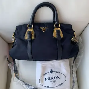 Pre-owned PRADA Navy blue nylon with leather trim, gold logo, bowling tote bag, top handle & crossbody/WJ03117804