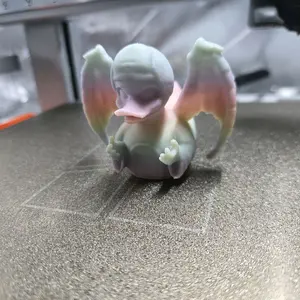 Glow in the dark rainbow angel statue duck