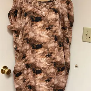 Somaali Baati Fashion and Hat - Details Unknown from the Provided Information