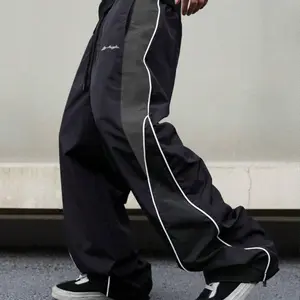 Men's Black Colorblock Sweatpants with White Side Stripes & Embroidered Design for Gym Wear, Loose Athletic Long Pants, Sporty Elegance, Drawstring Waist, Straight Leg Cut, Trendy Street Fashion Joggers Sports Menswear Embroidery Embroidery Tracksuit