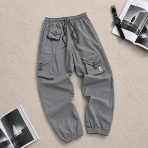 Men’s Grey Asymmetric Multi Pocket Letter Embroidery Cargo Joggers, Elastic Drawstring Waist Street Tapered Pants, Techwear Style, Y2K Fashion, Utility Cargo, Viral Streetwear, Clean Fit, Urban Core, Daily OOTD, Relaxed Fit Trend valkyrie casual