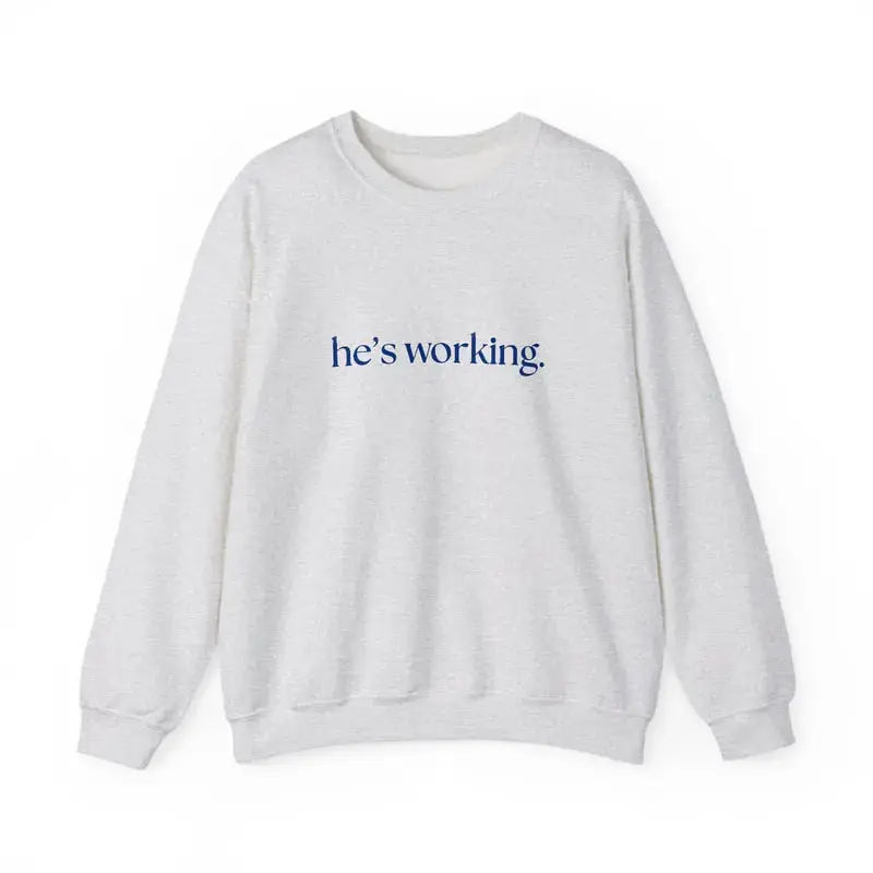 "he’s working" Crewneck Sweatshirt – A comfy, stylish choice for everyday wear, ideal for those always on the go and staying productive.