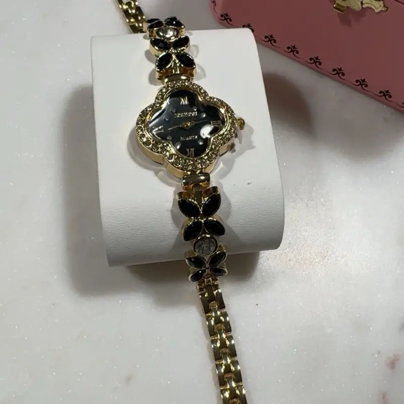 Black and Gold Clover Watch with Butterflies Elegant Design for Women
