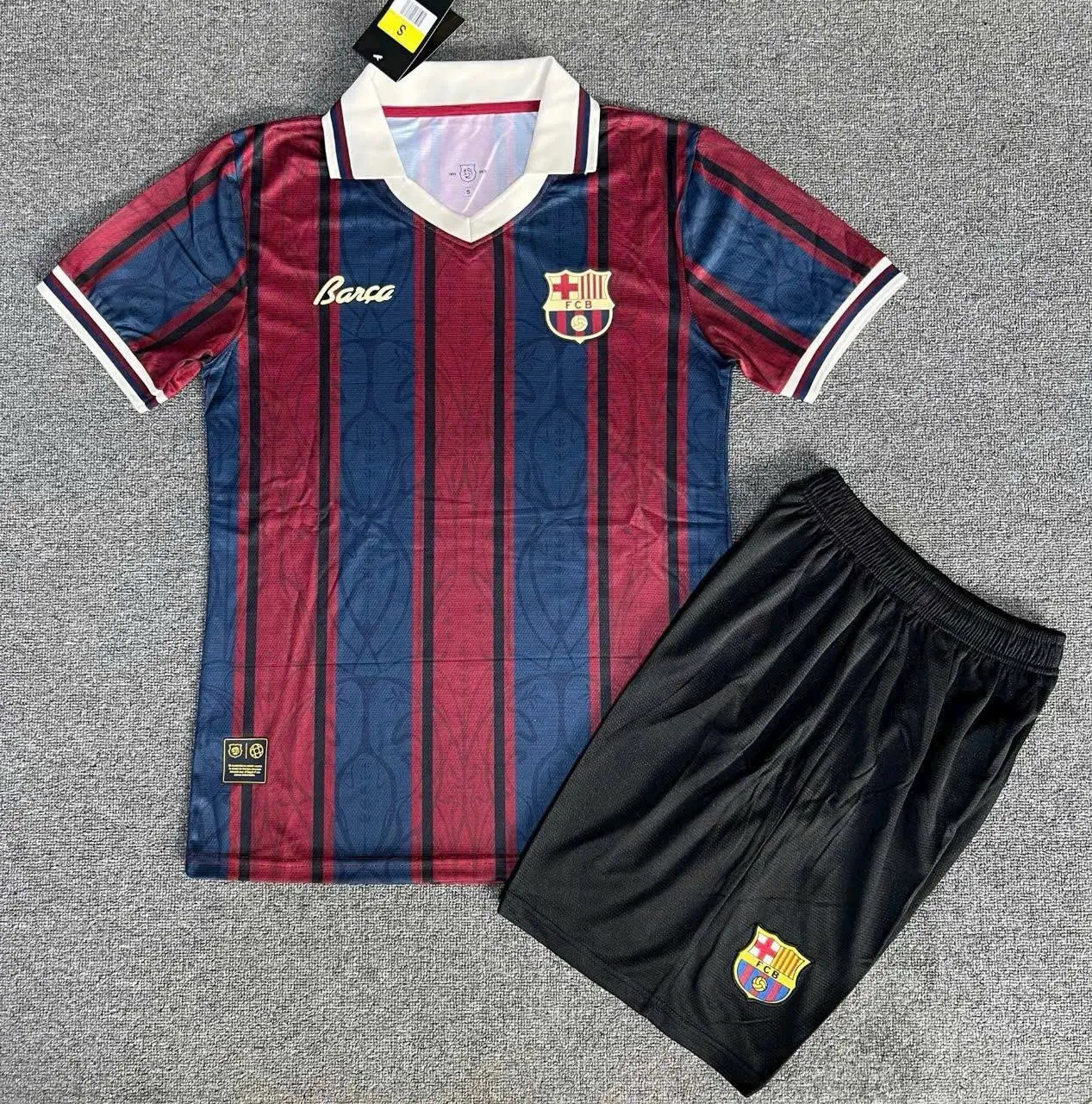Barcelona Retro Striped Soccer Jersey Set Grey Carpet Flat Lay Display | Collared Short Sleeve Kit Shorts | UEFA Champions League Fan Apparel Gift
