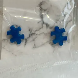 Puzzle shaped stud earrings