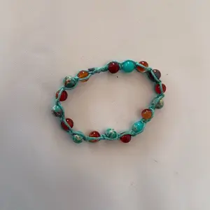 Teal and red bracelet with teal hemp