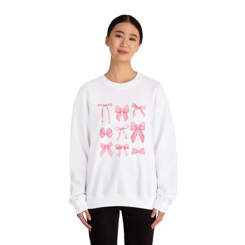 Unisex White Fashion Sweater – Cute Pink Bow Print Design, Soft and Comfortable Fabric, Easy to Style, Perfect for Casual Outings, School, and Streetwear gilmore  girls  merch