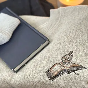 Book lovers sweater. Crewneck bird on a book