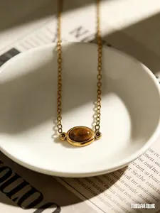 Tiger Eye Stone Gold Bean Necklace | Warm brown hue with a gentle vibe, made of titanium steel that won’t fade. Perfect for daily commutes or dates, instantly boosting your feminine charm