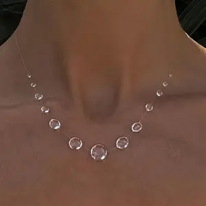 A women's elegant symmetrical beaded necklace featuring clear artificial crystal spheres. A sparkling piece, perfect for Valentine's Day, parties, and everyday wear – a versatile gift necklace for all seasons.