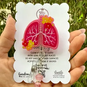 Acrylic Badge reels with removable matching charms live claims.