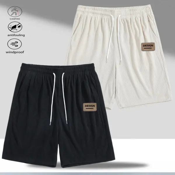 Two men's casual shorts, featuring a fresh and stylish design, drawstring waistband for added comfort, leather label for a refined touch, perfect for men who value both comfort and practicality.
