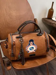 Michael Jackson holding a Boston bag with a globe pattern; lightweight handbag; a fashion lover's gift for Mother's Day.