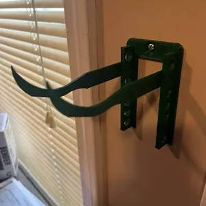 Wall hanger controller holder